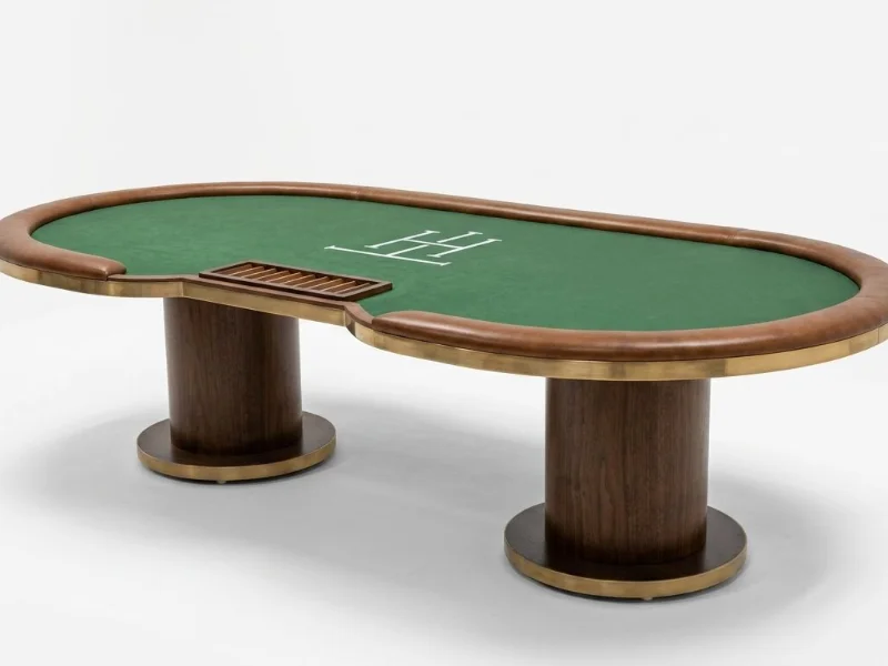 Oval brass-edged poker table with tan leather rail, green printed felt and walnut pedestals