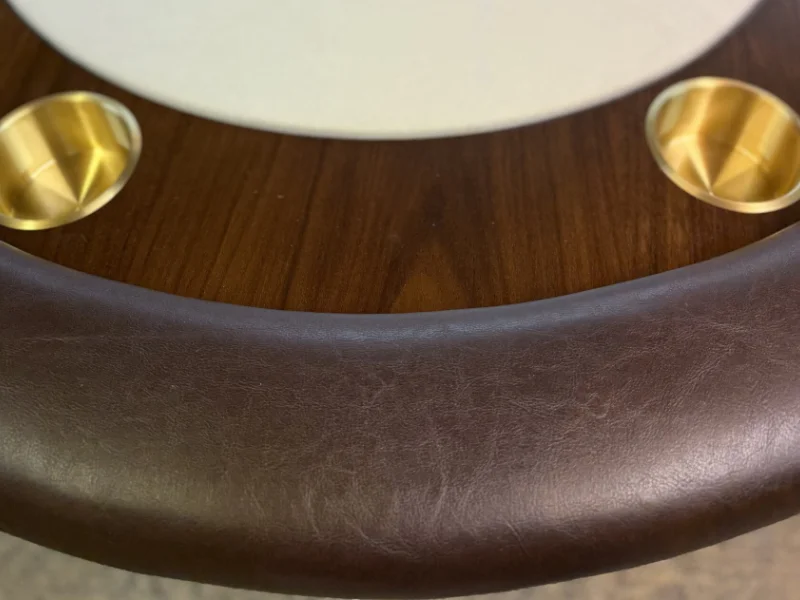 Brass cup holders and leather rail close-up